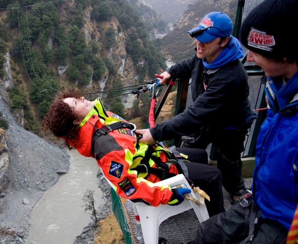 Vladka is all smiles as she attempts the Shotover Canyon Swing - The Chair style. Shotover Canyon Swing crew Brad Cutler (L) and Benjamin Lucas give Vladka a helping hand.